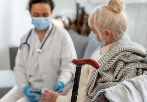 doctor taking care senior woman.jpg
