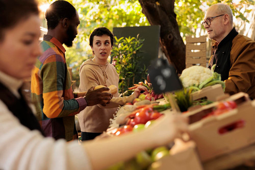 diverse family looking farmers market fresh produce buying organic locally grown veggies senior farm.jpg