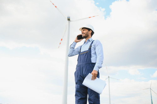 worker inside sustainable energy industry engineer working alternative renewable wind energy station.jpg
