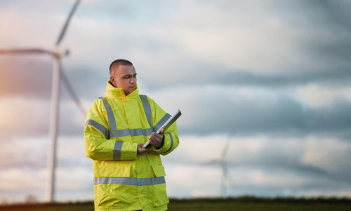 wind turbine engineer male engineer maintains controls wind turbine energy generation background win.jpg
