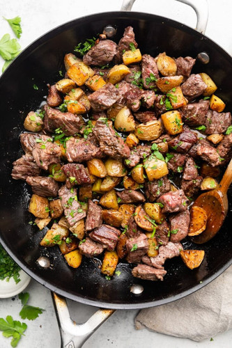steak bites and potatoes in the skillet 730x1095.jpg