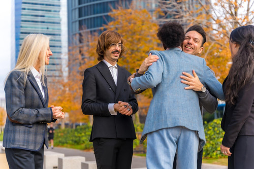 middleaged multiethnic businessmen businesswomen shaking hands good working environment 242111 25124.jpg