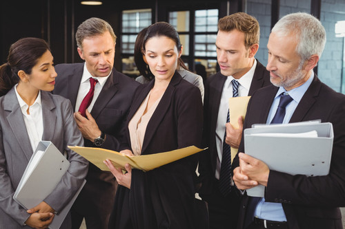 lawyer looking documents interacting with business people 107420 15946.jpg