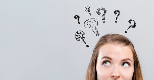 Hand draw question marks with young woman 1134373862 2406x1251.jpg