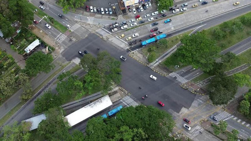 aerial drone shot of traffic flowing through complex intersection.jpg