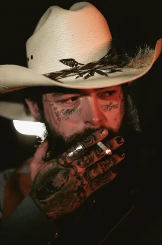 post malone smoking with cowboy hatadam degross 658405 713x.webp