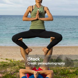 yoga sitting on legs pose by the sea.png