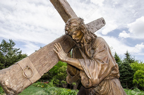 21368090 a detailed life size statue of jesus carrying the cross in the gardens of thanksgiving poin.jpg