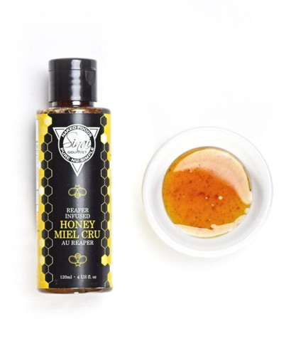 Hot honey is honey that has been infused with fresh or dried chili peppers, the result is sweet honey with a kick of spice. You can change the level of heat depending and what pepper you use. 100% Real Canadian Honey, Local plums, mint, and hot peppers, Artisanal Honey from Quebec and Ontario, Canada. Visit https://www.sinaigourmet.com/product/artisanal-hot-honey-limited-run/ for more information.