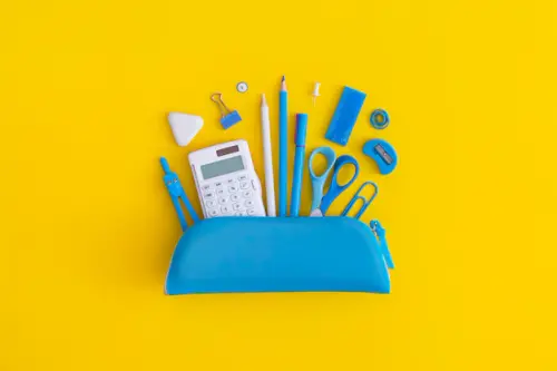pencil case with school stationery yellow background 135892 278.webp