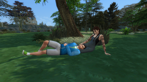 Shane and Elsie lying in the grass.png
