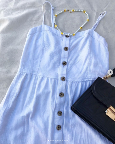 Vestido blanco cute con bolsitas.png
