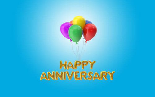 Happy Anniversary text made with colorful balloons are hanging and flying in the sky. Business and f.jpg