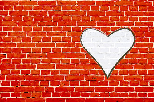 A red colored brick wall with rectangular blocks, textured grungy backgrounds and one white big hear.jpg