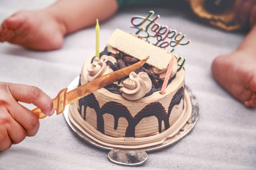 Father and Daughter in Front of Birthday Cake.jpg
