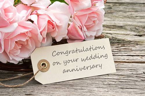 pink roses and card to wedding anniversary.jpg