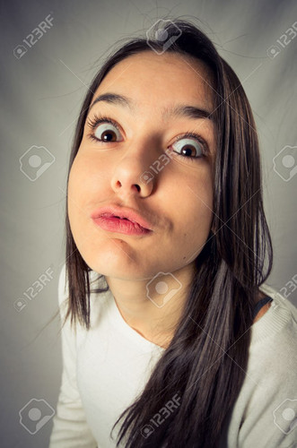 35070271 wide angle distorted funny face of a teenager girl in a kissing expression.jpg