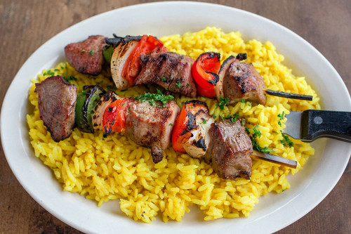 chicken and vegetable shish kabobs on a skewer with rice.jpg