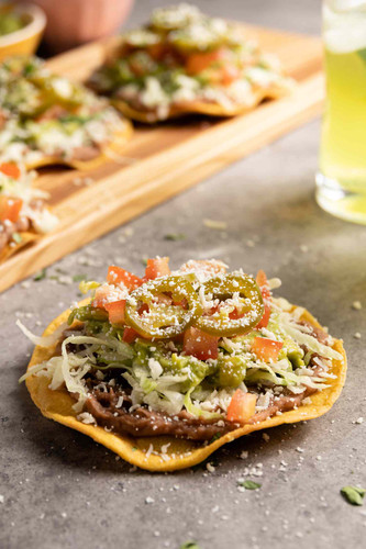 Simply Recipes Mexican Tostada LEAD 4 acbcd5e6b81d478fa1e2f0718058de80.jpg