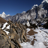 A mani wall on route to Kunde, Ama Dablam in the distance