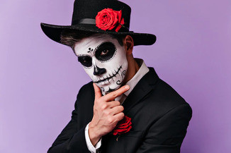 pensive man with traditional mexican makeup looking camera studio shot guy zombie outfit posing befo.jpg