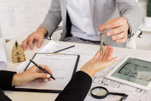 man giving some keys woman min.jpg