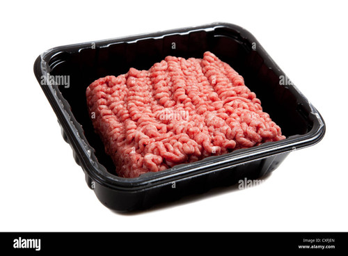raw hamburger meat in a black container on a white background CXFJEN.jpg