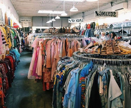 Racks of clothes for sale in a Michigan thrift store and donation center.jpg