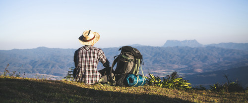 tourist from mountain top sun rays man wear big backpack against sun light (2).jpg