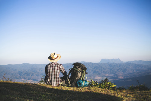 tourist from mountain top sun rays man wear big backpack against sun light (2).jpg