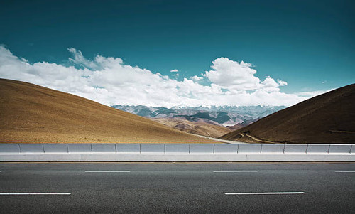 Empty asphalt road and mountain background ..jpg