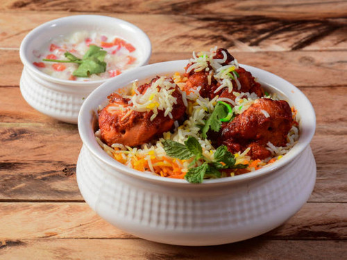 Chicken Tikka Biryani made of Basmati rice cooked with masala spices, served with yogurt, selective .jpg