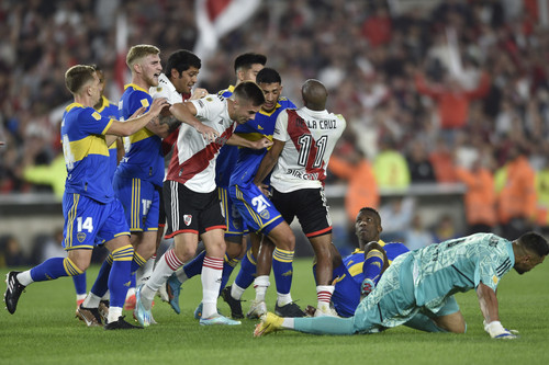 Players of River Plate and Boca Juniors fight during a local tournament soccer match at Monumental s.jpg