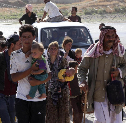 Displaced people from the minority Yazidi sect fleeing the violence in the Iraq.jpg