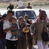 Displaced people from the minority Yazidi sect fleeing the violence in the Iraq