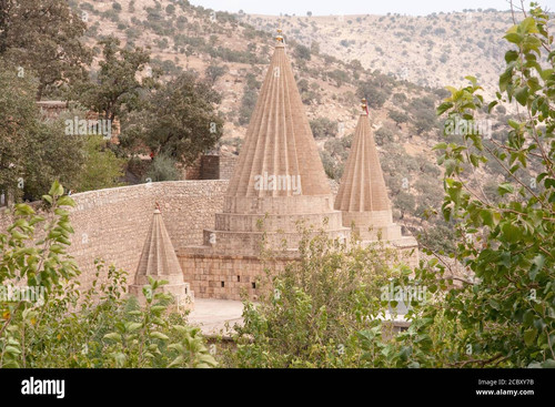 a view of the spires and mausoleums of the tomb of sheikh adi at the holy yezidi religious site of l