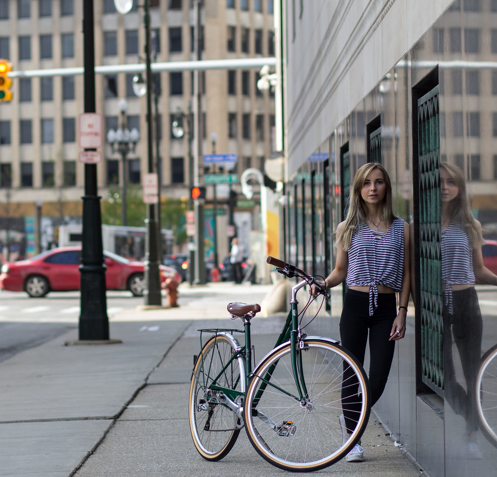 Detroit Bikes Customer Standing Against Bike In City