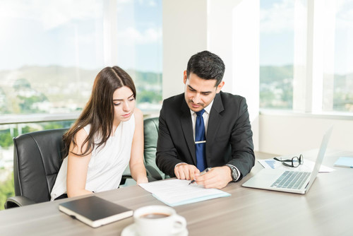 young adviser explaining legal document client his office.jpg