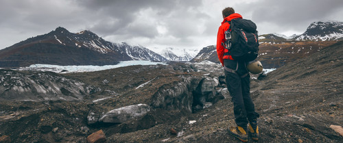 hiking adventure travel man watching glacier icelandedit.jpg