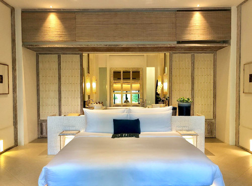 luxury bedroom interior with rich furniture scenic view from walkout deck.jpg