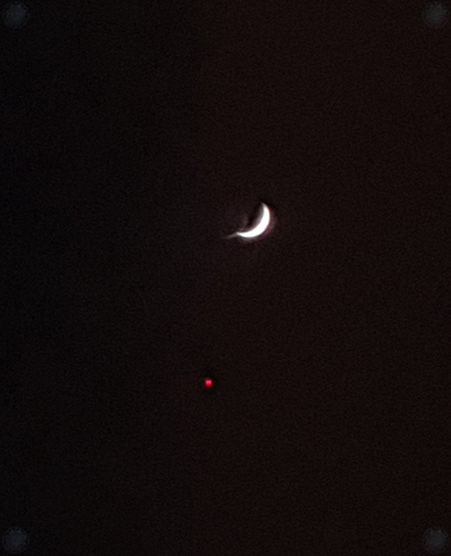 Nighttime crescent moon and plane dot??.png