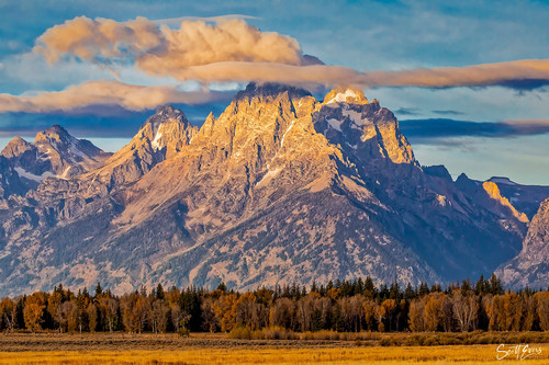 Early sunlight and low clouds on the Teton Mountain range on a fall day..jpg