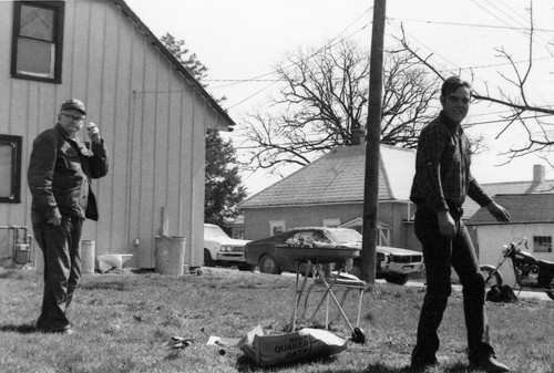 Henry in Knob Noster by house where he lived.jpg