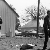 Henry in Knob Noster by house where he lived