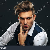 stock photo portrait od handsome man in studio on dark background 1017050245
