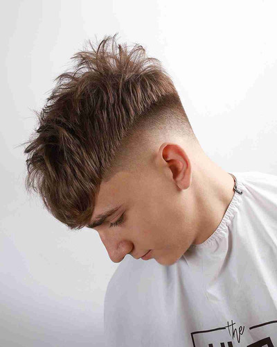brushed forward french crop with a mid fade for guys with thick hair.jpg