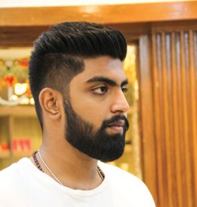 Fade Haircut with well trimmed beard Hairstyles For Men e1641298122636 285x300.jpg