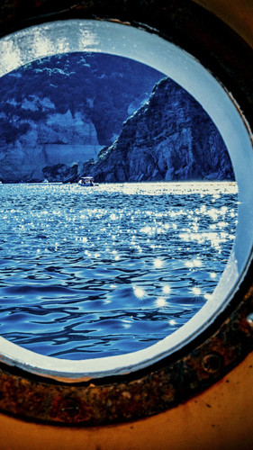 Social media story Sea and mountains viewed through a cabin window..jpg