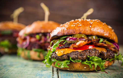 Close-up of home made tasty burgers on wooden table..jpg
