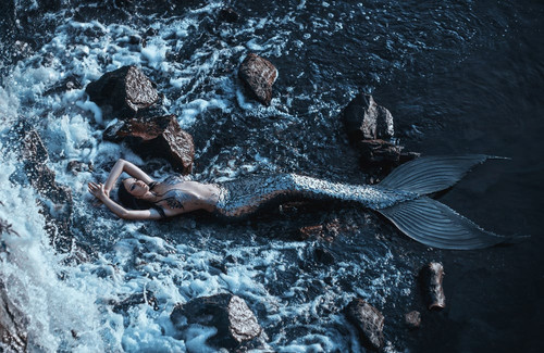 real mermaid posing relax resting ocean shore.jpg